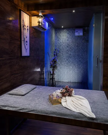 Therapy room with attached shower in ambient blue light